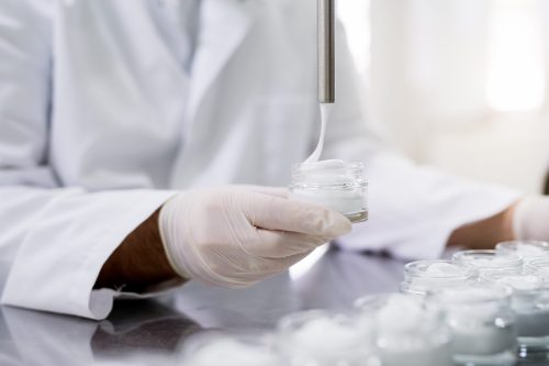 Protective worker health care industry products. Medicine concept production. Medical production, health care industry. Medicine concept employee.